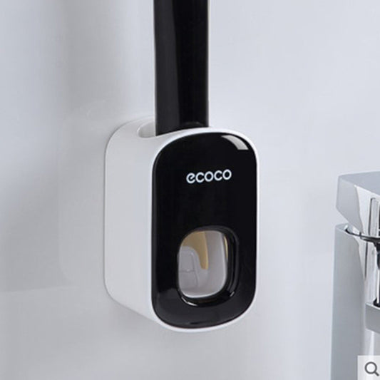Black and white toothbrush holder with 'ecoco' branding on a light gray background