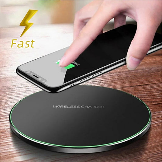 Hand placing a smartphone on a wireless charger with 'Fast' text and lightning bolt icon.