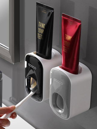 Eccoo toothbrush holder with toothpaste dispensers on a gray surface