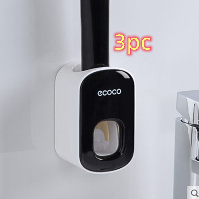Black and white toothbrush holder with 'ecoco' branding on a light gray background